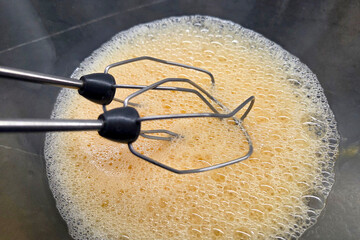 Whisking Batter with Electric Mixer for Baking Preparation and Cooking Concepts