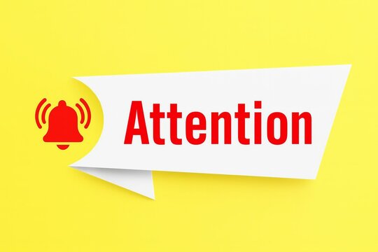 Red notification bell icon and the word attention in a speech bubble on a bright yellow background symbolizing alerts and important messages