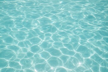 Obraz premium Clear blue water with sunlight reflection. Ripple pattern on transparent sea surface. Summer vacation, swimming pool, aqua texture background. copy space