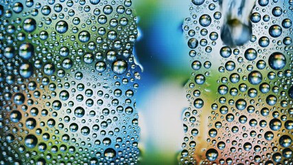Water droplets delicately clinging to the surface of a glass window, capturing the fragile and ephemeral nature of lifes tiny moments, perfect for use in cooking show backgrounds or restaurant.