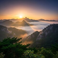 A scenic mountainous landscape captures the morning sunrise, light rays spilling over misty valleys and peaks. Verdant foliage in the foreground