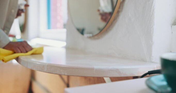 Barbershop, wipe and man with cloth, table and cleaning to remove bacteria with maintenance. Hygiene, hair stylist and entrepreneur with routine, germ prevention and business owner with disinfectant