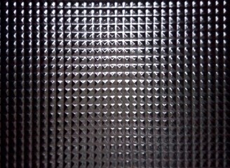 Glass with pyramides engraving background