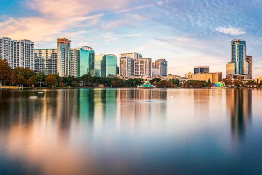 Amazing view of Orlando skyline in Florida and reflection in Lake Eola.