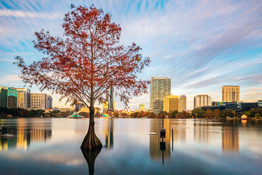 Amazing view of Orlando skyline in Florida and reflection in Lake Eola.