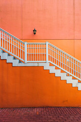 Orange wall with a white stairs in Orlando Florida