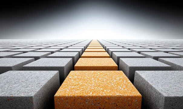 A pathway of orange and gray concrete blocks extends into a blurred background, creating depth