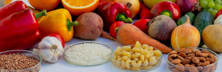 Set of basic healthy eating ingredients: vegetables, grains, and nuts with copy space