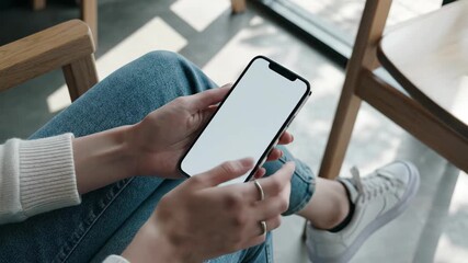 Relaxed woman scrolling blank phone screen, perfect for app promotion in lifestyle video - Powered by Adobe