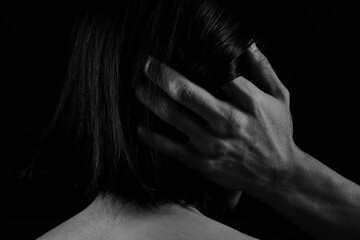 Subtle hand placement denoting trust and soft intimacy between individuals