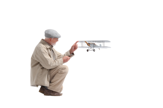 Senior working on intricate model plane design isolated on transparent background