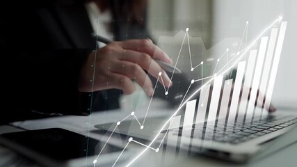 A businessman works on a laptop, analyzing financial data trends and graphs in a modern office. The image illustrates a focus on growth and data-driven decision-making. Copula