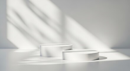 Minimalist white product display platforms with natural light and shadow patterns