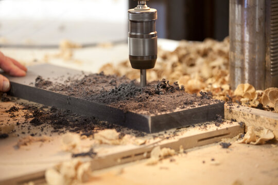 Machine drilling a hole