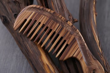 Handcrafted wooden comb with natural wood grain texture