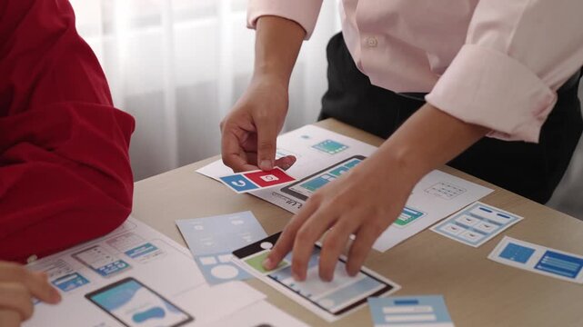 Panorama video of startup company employee planning on user interface prototype for mobile application or website in office. UX UI designer brainstorm designing user friendly interface plan. Synergic