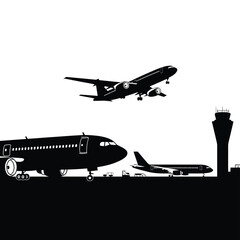 Silhouette of airplanes at an airport with a control tower