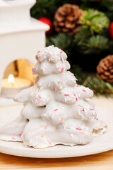 Gingerbread christmas tree. Beautiful xmas dessert and classic decorations the background.