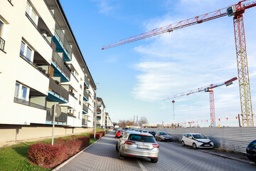 KRAKOW, POLAND - NOVEMBER 19, 2025: Large-scale construction site of a new housing estate opposite the existing block.