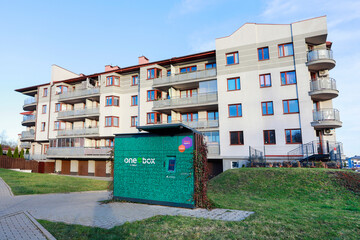 KRAKOW, POLAND - NOVEMBER 19, 2025: The parcel collection machine is located directly in front of the apartment building's windows. The location is unwise, and the noise of the door banging
