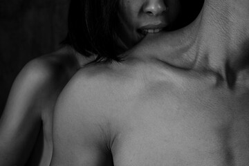 Loving pair in quiet repose surrounded by textured skin and