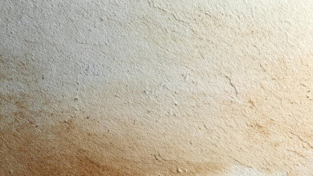 A weathered, textured wall surface exhibiting a natural gradient from light off-white to sandy brown, with subtle cracks and rough imperfections creating an aged aesthetic.