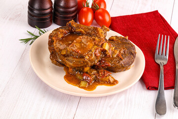Italian cuisine - ossobuco with sauce