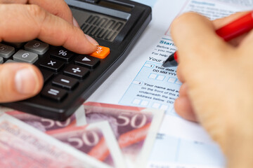UK Tax Return. Financial Concept. Self-employment, Self-Assessment, dual resident, UK property. Filling in tax returns