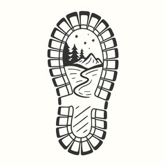 Artistic boot print reveals mountain landscape with trees under starry night sky