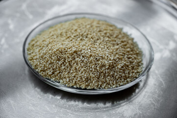 Close-up of sesame seeds placed in a plate.