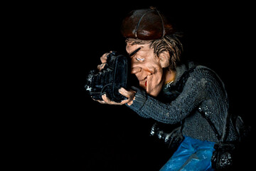 Ceramic figure of an old photographer with photo equipment.