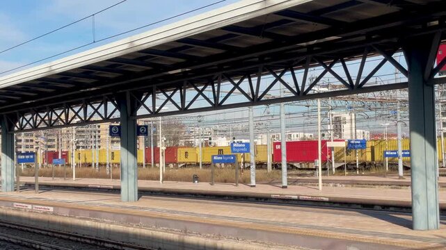 An industrial freight train is captured at Rogoredo station in Milan, Italy.
