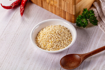 Raw dry sesame seeds heap