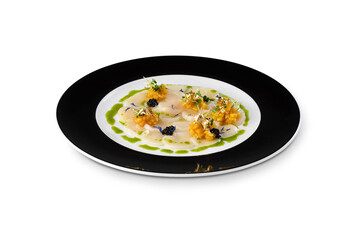 Fresh scallop carpaccio styled with mango salsa, caviar, microgreens, and edible gold flakes