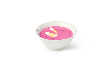 Vibrant pink cold borscht in a white bowl, topped with sliced hard-boiled egg