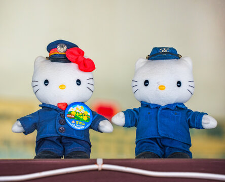 saitama, chichibu - mar 25 2025: Japanese Hello Kitty plush toys dressed in Chichibu Railway staff uniforms, one wearing a commemorative badge for Mt. Hodosan, displayed likely at Ohanabatake Station.