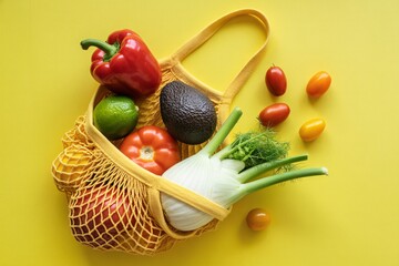 Fresh produce in reusable bag healthy eating vegetables and fruits concept