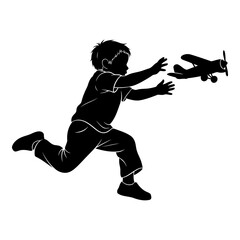 Black silhouette of a boy running to catch a toy airplane child chasing 1