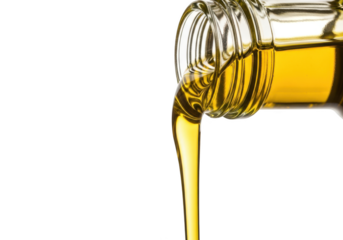 Golden olive oil pouring from a glass bottle, healthy cooking ingredient isolated on transparent background
