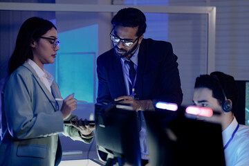 Code review huddle ignites problem solving Senior dev guides colleagues analyzing script tablet...