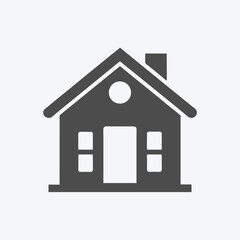 Simple dark gray house shows chimney and two windows on a white background