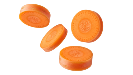 Four Sliced Carrots Floating Against Black Background