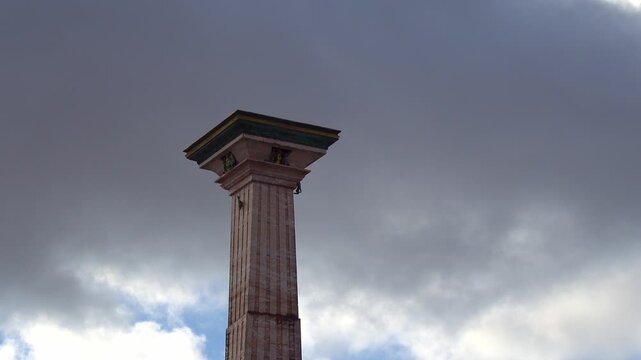 Bordeaux A Majestic Architectural Column Reaching Towards the Overcast Sky,