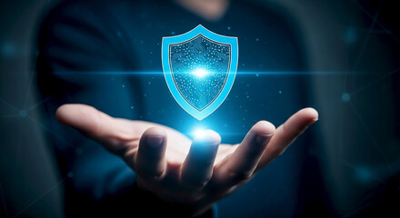 Digital shield of protection glowing brightly in a person s open palm symbolizing cybersecurity data privacy and digital security in a futuristic concept