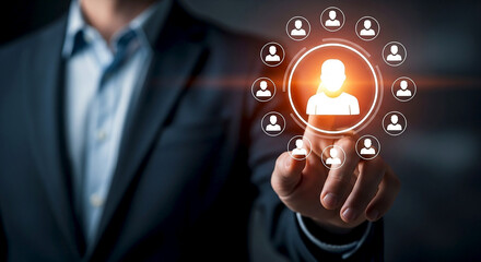 Businessman touching a glowing digital network of people icons representing connections teamwork and a central figure in a business or social network
