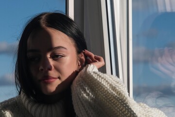 Portrait of a girl near the window