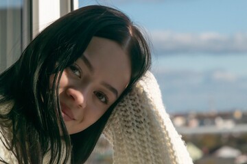 Portrait of a girl near the window