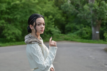 A girl in a festive outfit walks down the street