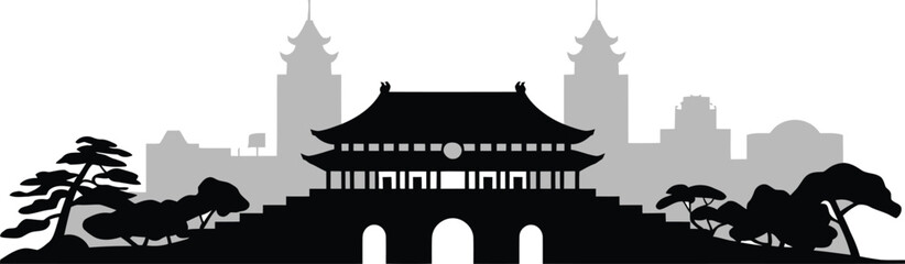 Historic korean style gate silhouette with traditional tiered roof and surrounding pine trees