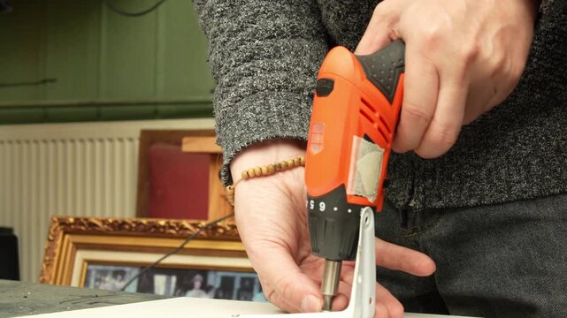 High-Detail Close-up of Electric Screwdriver Working on DIY Home Project